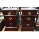 A pair of stained hardwood three drawer bedside chests with turned half pillar mouldings, 40 x 40