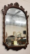 Large fret-cut mahogany framed mirror with arched and bevelled plate in parcel gilt frame 105 x 70cm