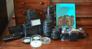 A Canon AE-1 35mm camera no 3377408 to/w Canon zoom lens FD 100-200mm 1:5.6  and FD 35-105mm 1:3.5-