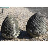 A pair of weathered cast stone pineapple finials, 35 cm h (2)