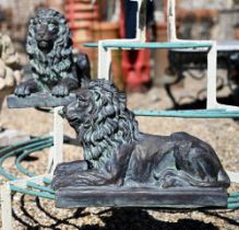 A pair of Empire style bronzed composite recumbent lions, 40 cm long x 27 cm h (2)