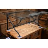 An artisan wrought steel framed glass top coffee table, 11/5 cm x 81.5 cm x 50 cm h