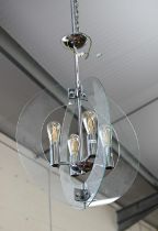 A contemporary 'solstice' stem hung four-light ceiling pendant in polished chrome with semi-circular
