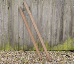 Two vintage oak short hand rails with brass wall fittings, 151 cm and 132 cm long (2)