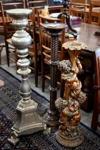 A composite cherub torchere stand to/w two other torchere stands; one spiral turned mahogany and one