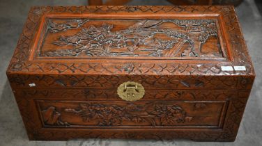A small Chinese carved hardwood camphor-lined blanket chest/coffer with brass clasp, 86 x 40 x 40 cm