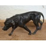 A bronzed metal figure of a hound, 5 x 10.5 cm