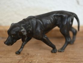 A bronzed metal figure of a hound, 5 x 10.5 cm
