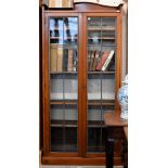 A mahogany bookcase with leaded glazed doors enclosing adjustbale shelving, 188 x 28 x 180 cm high