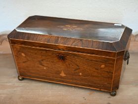 A large 19th century inlaid rosewood sarcophagus tea caddy with two bone-handled covered inner