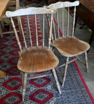 A set of four provincial elm and beech spindle back dining chairs