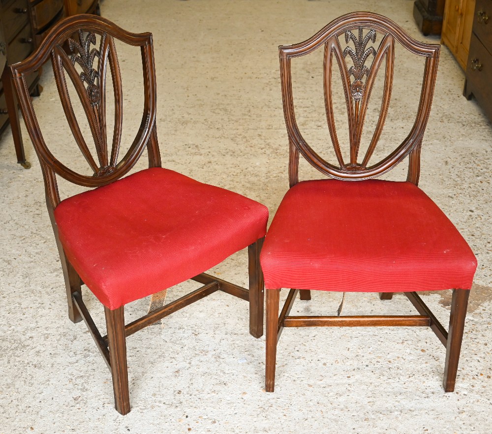 A set of six Edwardian mahogany Hepplewhite style shield-back dining chairs carved with wheat- - Image 2 of 3