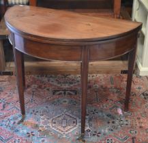 A 19th century mahogany demi-lune tea table, re-stained folding top, moulded supports and brass