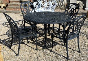 A cast alloy circular garden table with four chairs 124 cm diam (5)