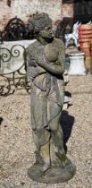 A classically styled weathered cast stone garden figure, 117 cm h