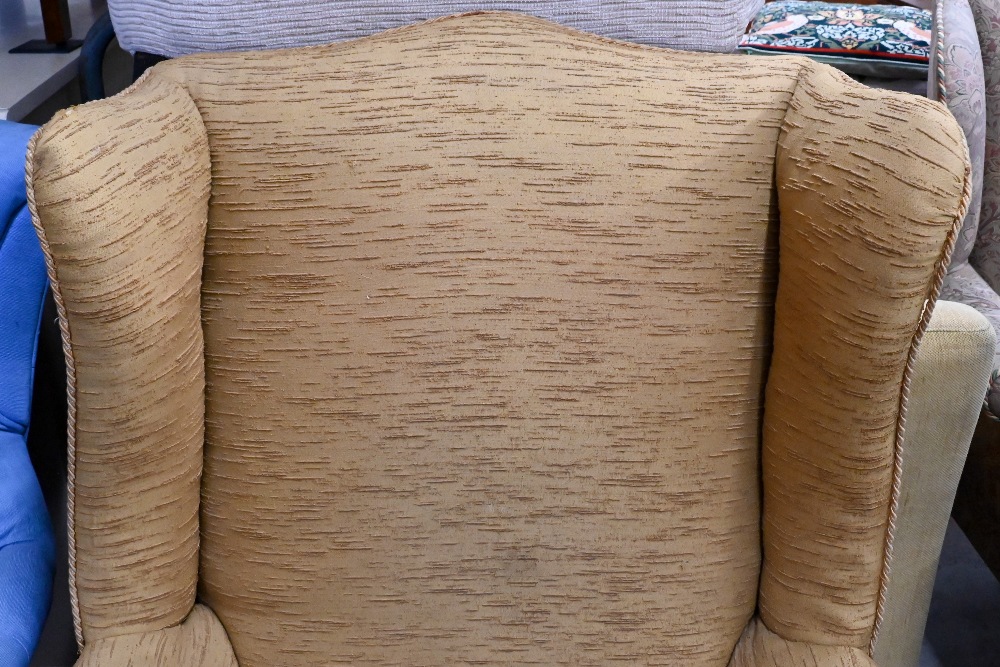 A wingback armchair covered in gold textured fabric, on cabriole supports - Image 2 of 4