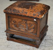 An oak leather top box stool carved with 'Immaculata Gens' Welsh heraldic crest to front (