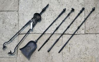 Various antique style steel fire-irons including tongs, shovel and three pokers