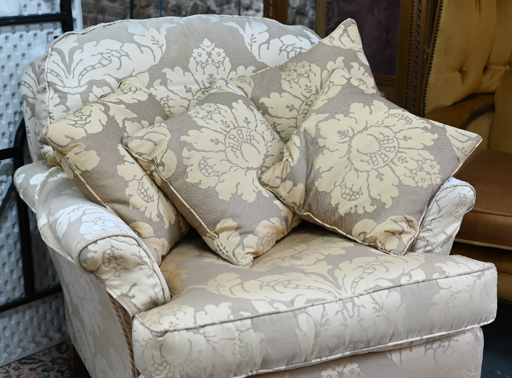 A contemporary cream/gold floral upholstered wing armchair by Duresta to/with an easy armchair in - Image 2 of 4