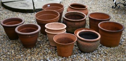 Four various pairs of terracotta planters to/with four other differing planters and four drip