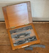 A boxed vintage set of twelve Figgins (London) letterpess angle quads