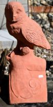 A cast terracotta owl ridge tile, 43 cm h