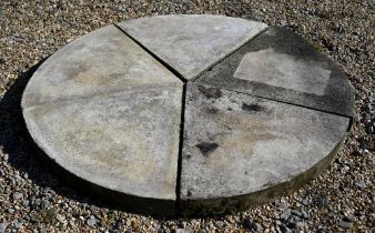 Five weathered cast stone paving segments, forming a circle, approx. 30 cm dia.