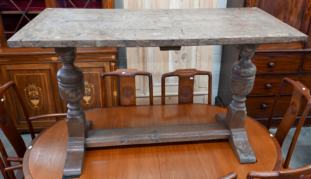 A small burr elm refectory table with cleated ends, on cup and cover supports, 122 x 56 cm