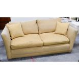 A contemporary three seater sofa in yellow upholstery by Highly Sprung Ltd, 187 x 95 x 71 cm h (seat