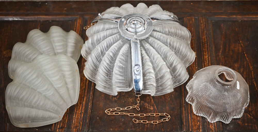 An Art Deco chrome and glass ceiling lightshade with frosted shell segments, to/w two other shell