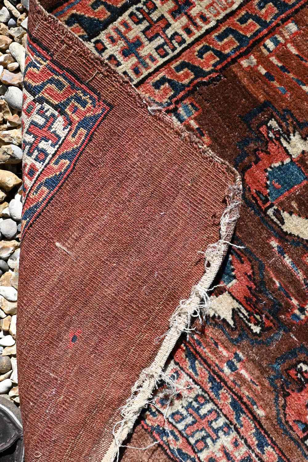 An small antique Turkoman rug, 122 cm x 78 cm to/w a Turkoman bag face, 97 cm x 84 cm and a camel - Image 5 of 6