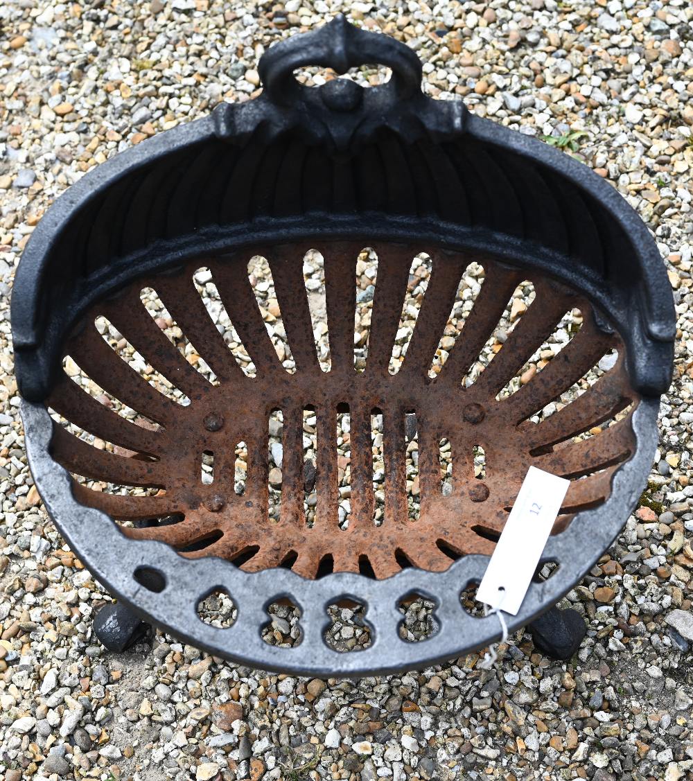 An old oval cast iron fire basket, raised on scroll feet, 40 cm w - Image 2 of 2