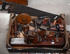 A selection of vintage joiner's tools, including Jack-plane, moulding planes, braces, panel saw