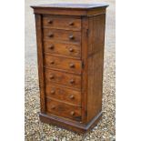 A Victorian oak secretaire Wellington chest of drawers, with original turned fittings raised on a