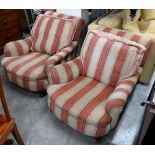 A pair of mahogany framed country house armchairs in red/beige striped fabric upholstery
