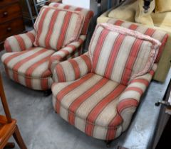 A pair of mahogany framed country house armchairs in red/beige striped fabric upholstery