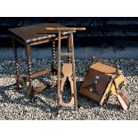 An Arts & Crafts oak coal box with brass and coal iron mounts, to/w a folding boot-jack and an oak