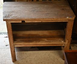 A rustic pitch pine French side table with tapered left hand side and open fronted under-tier, 104