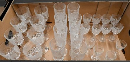 A suite of eight each vine-etched and cut wine glasses, champagne flutes and port glasses to/w
