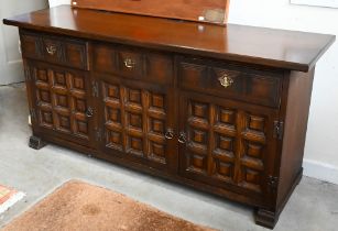 A 'Younger' Toledo oak Spanish style sideboard with three frieze drawers above panelled doors, 157cm