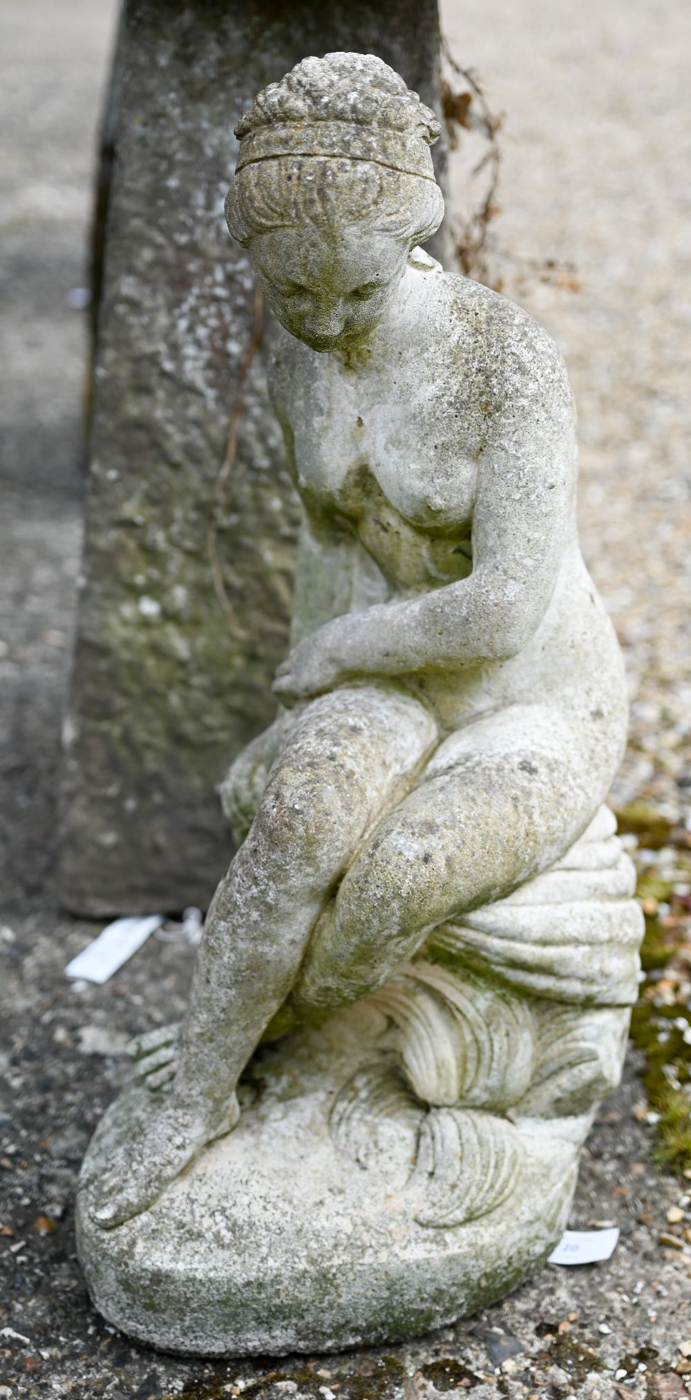 A weathered cast stone garden figure of a classical seated nude woman, 60 cm h - Image 2 of 3