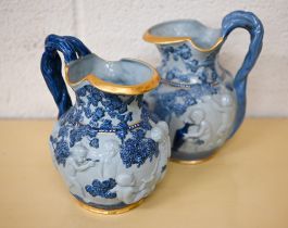 Two Copeland 'Spode's Florentine' jugs, embossed with Bacchanalian putti, 20 cm high