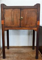 An antique mahogany two-door nightstand on moulded square supports, 50 x 40 x 73 cm high