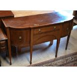 50A Victorian mahogany cross-banded breakfront sideboard, centred by a drawer over a shaped apron