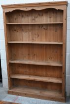 A modern pine open bookcase with four adjustable shelves, 122 x 25 x 182 cm high
