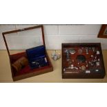 Two table-top dealer's display cases with hinged glass lids, containing various 19th century and