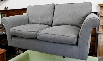 A modern two-seter scroll arm sofa with grey fabric upholstery (missing feet), 176 x 90 x 80 cm high