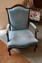 A stained carved walnut framed salon chair, light blue dralon fabric