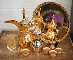 An Italian cased gilt metal Omani coffee pot on tray with six cups to/w another coffee pot and a