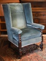 An antique oak framed wingback armchair in blue dralon upholstery, 80 cm w x 55 cm d x 176 cm h o/a